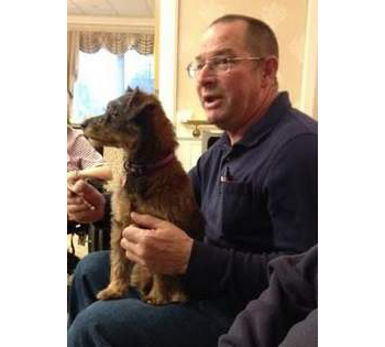 Bill Zompetti, with Bella on his lap,at Oak Knoll Healthcare Center in Framingham MA